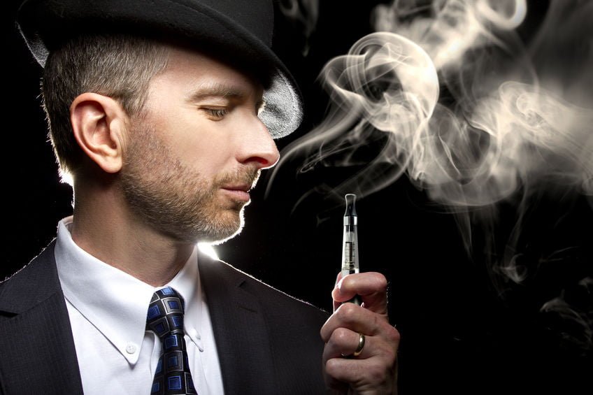 Man with hat vaping THC e liquid Europe market product