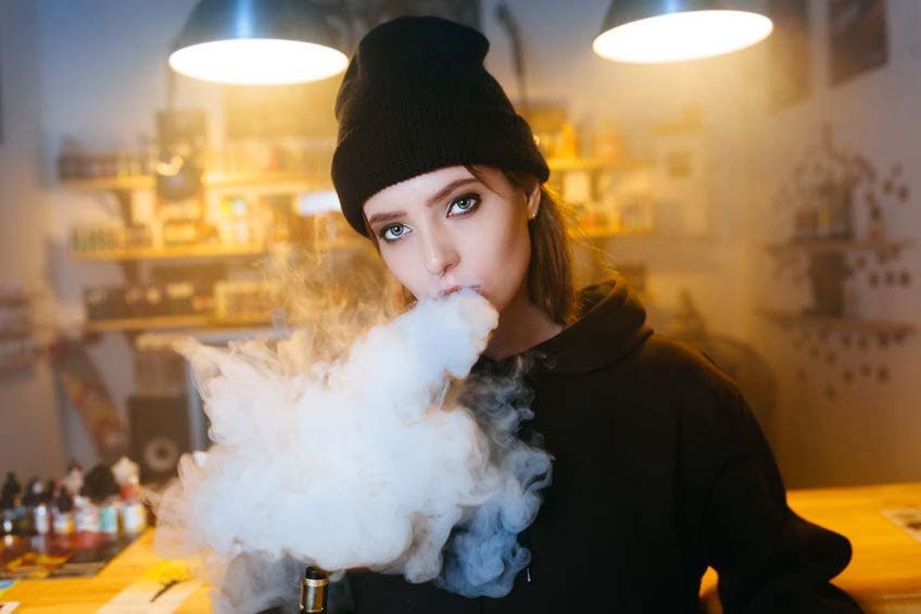 Girl with Hip Hop clothing for massive vaping article