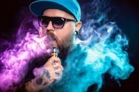 Man with beard vaping other drugs with smoke clouds